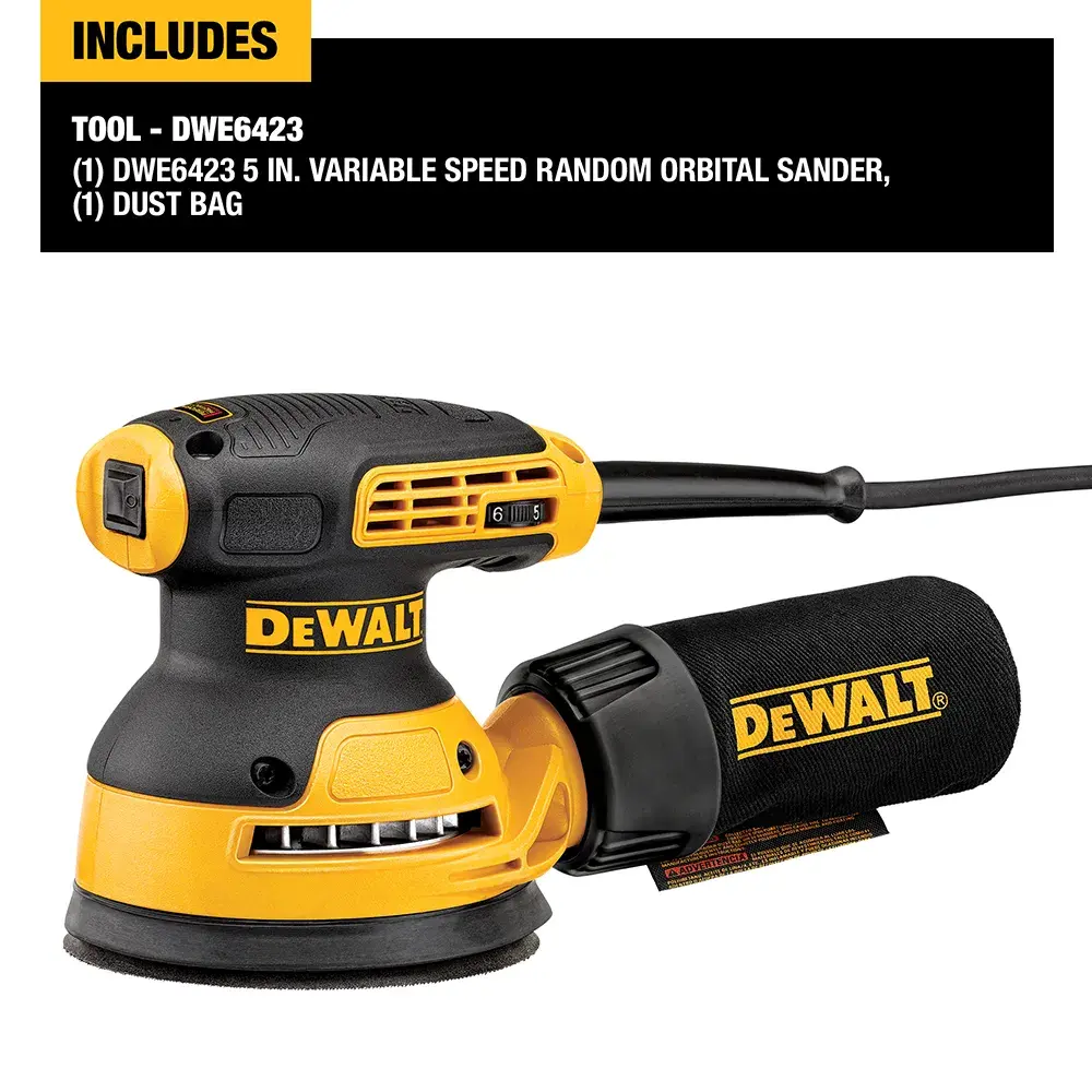 A person is using a DEWALT DWE6423 electric sander to sand a wooden chair in a workshop or garage.