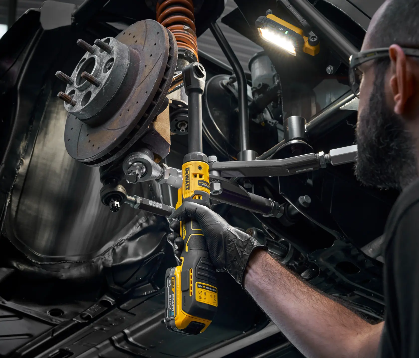 DEWALT DCF513EN-XJ, DCF513EN used on vehicle part. Compact photography tool for detail work.