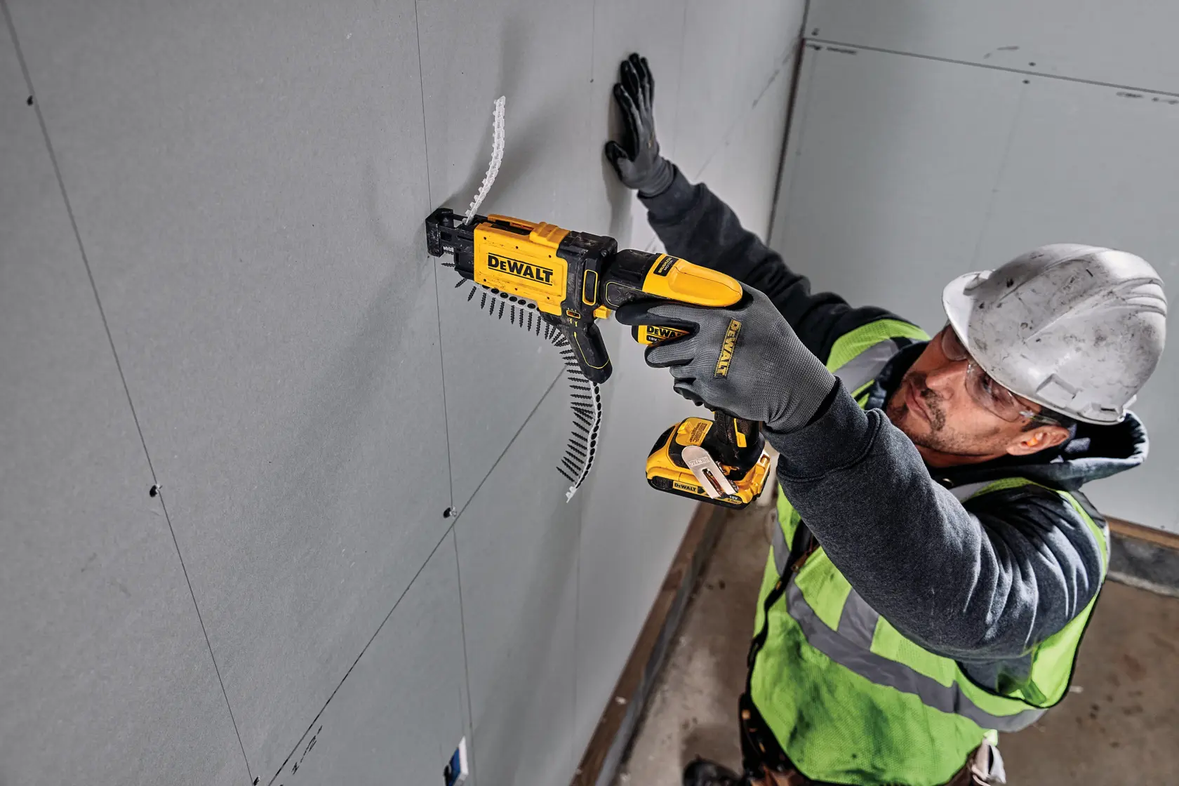 Side view of a DEWALT DCF6202 drywall screw gun attachment designed for use with power tools, featuring a yellow and black handle and casing.
