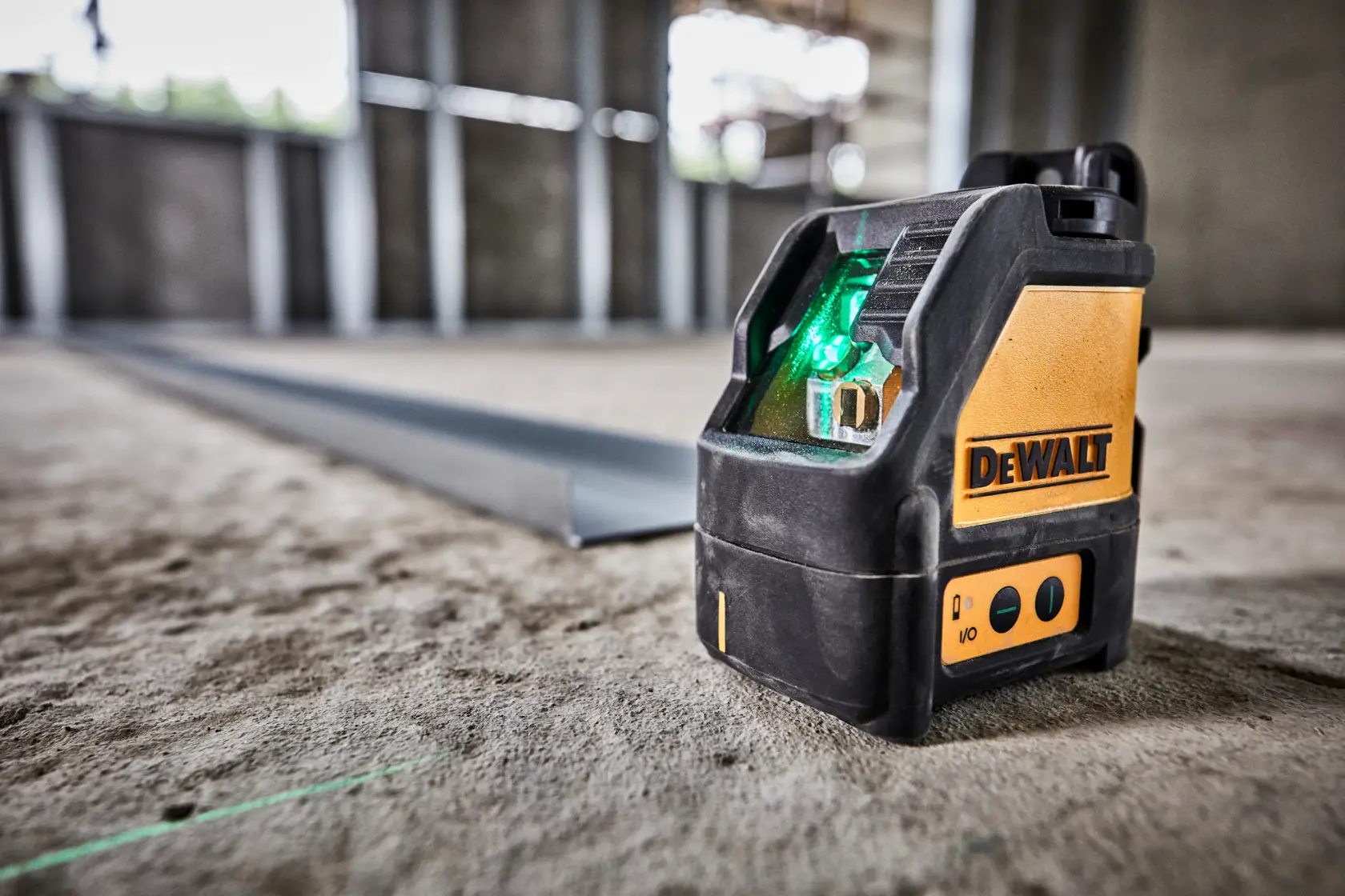 A DEWALT-branded yellow and black laser level device, featuring control buttons and magnetic mounts, designed for precise alignment in construction and photography applications.