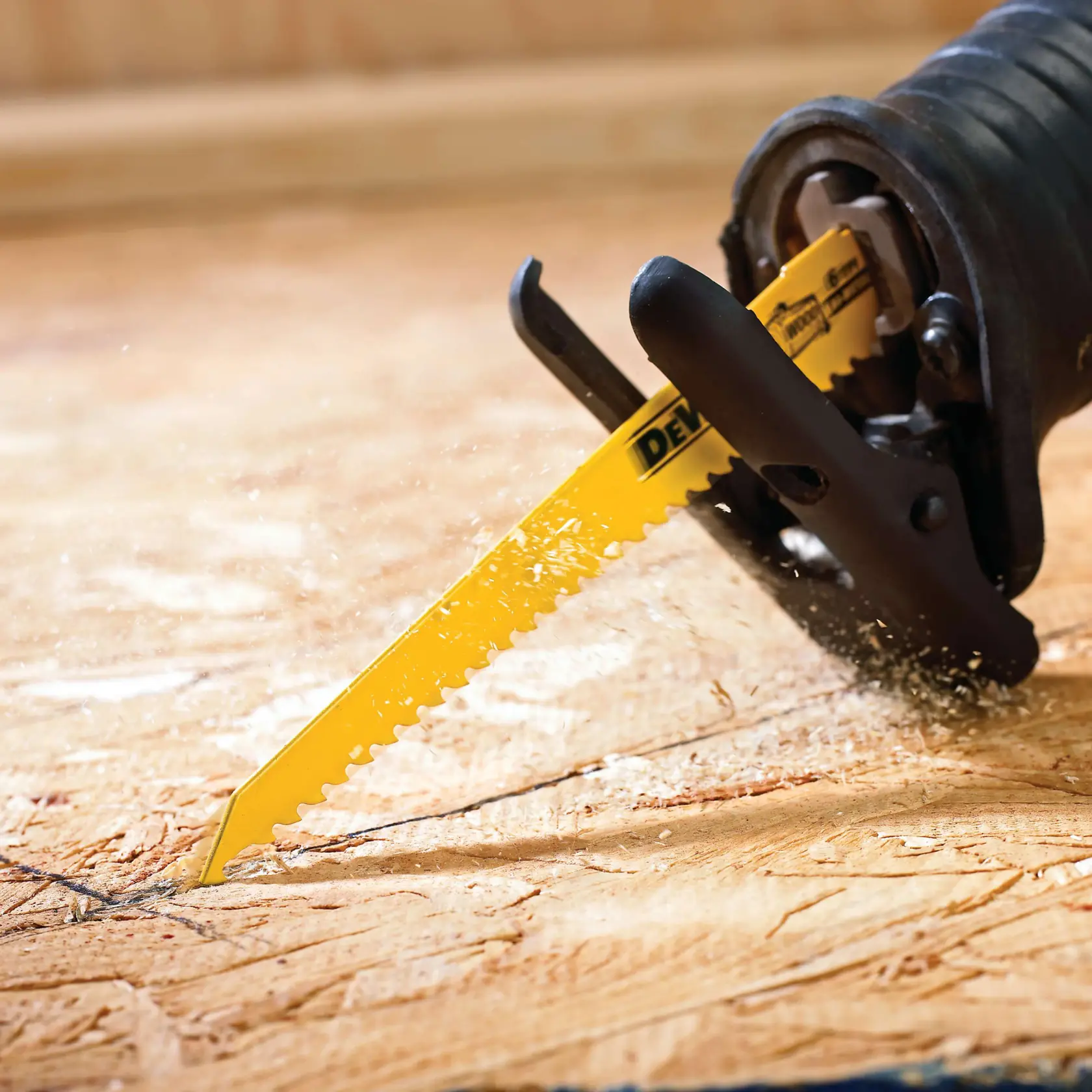 12 piece bi metal reciprocating saw blade cutting wood.